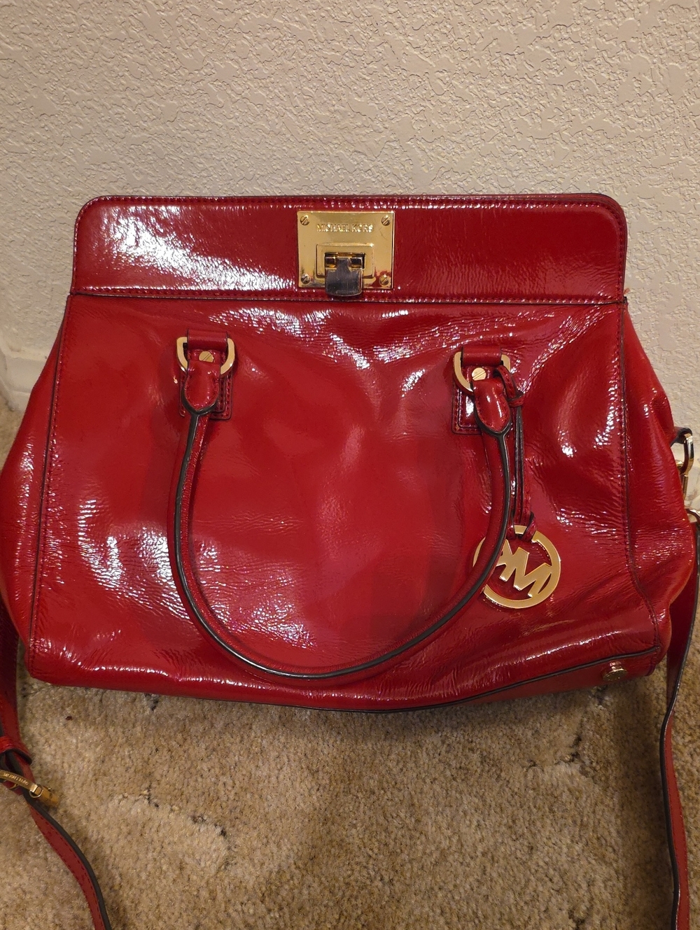 Michael Kors glossy red patent leather satchel with gold hardware